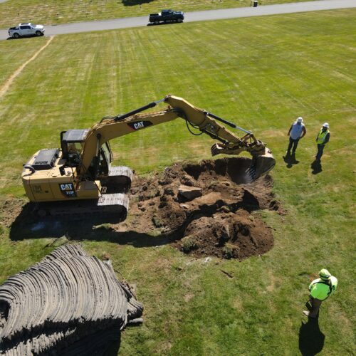 excavator rock drilling construction